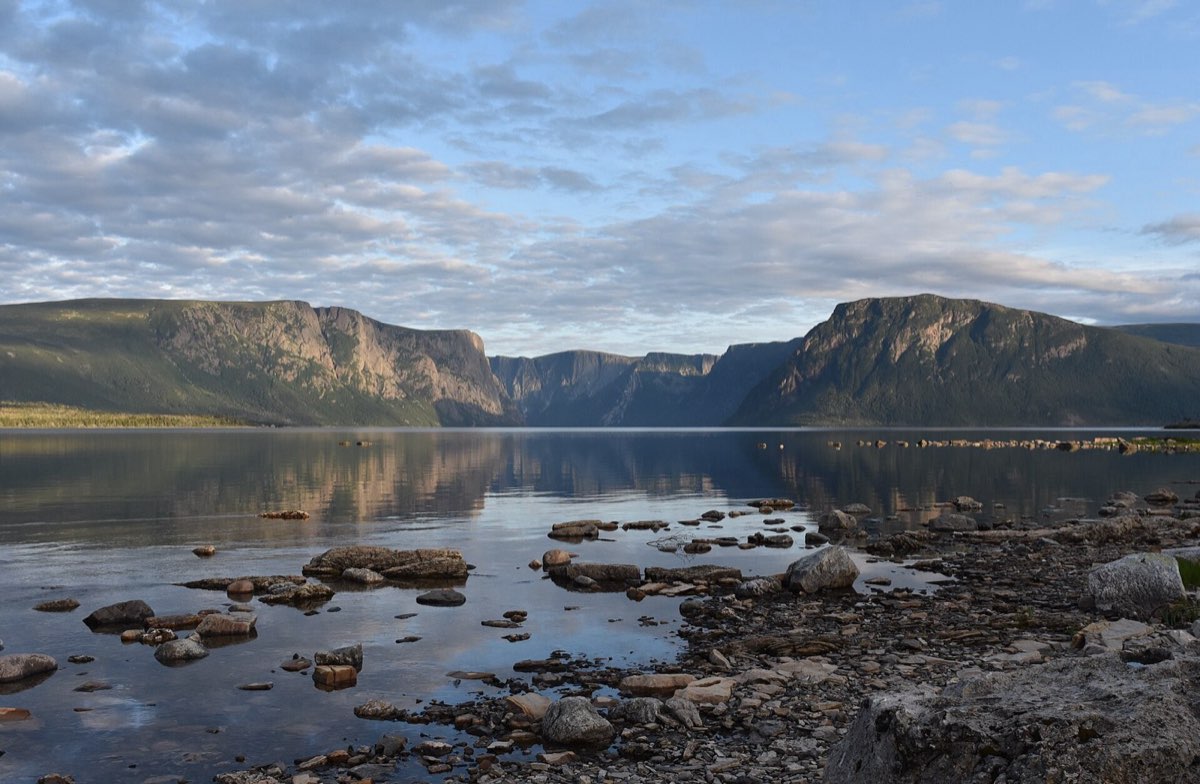 A steep-walled freshwater fjord under cloud in Gros Morne National Park