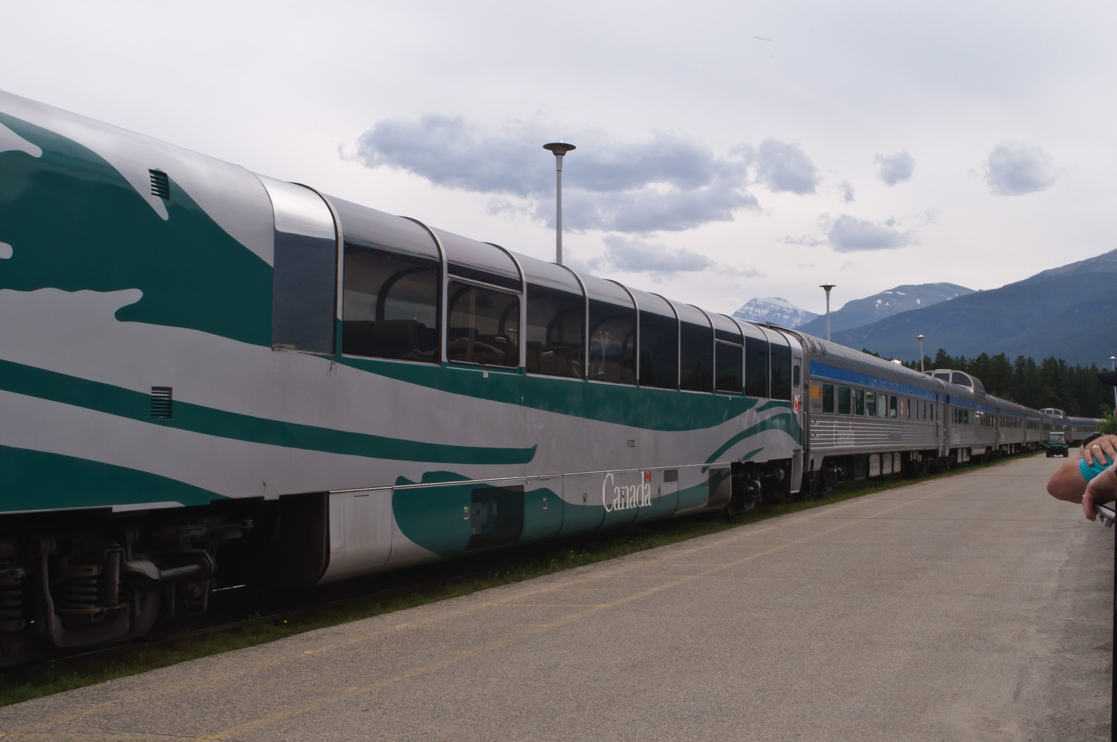 VIA Rail's stainless steel Canadian with its dome car at the Jasper station platform
